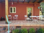 The patio has seating and a BBQ grill for entertaining friends and family